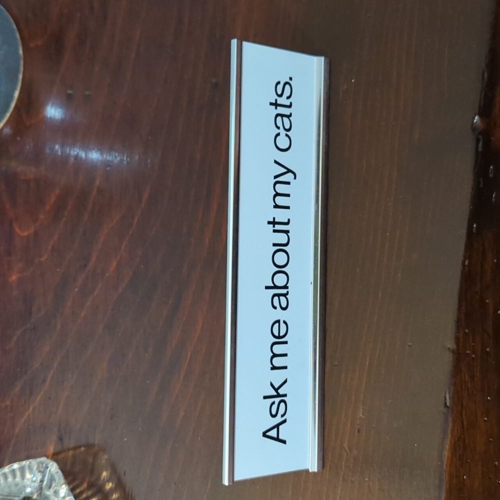 'Ask Me About My Cats' desk sign